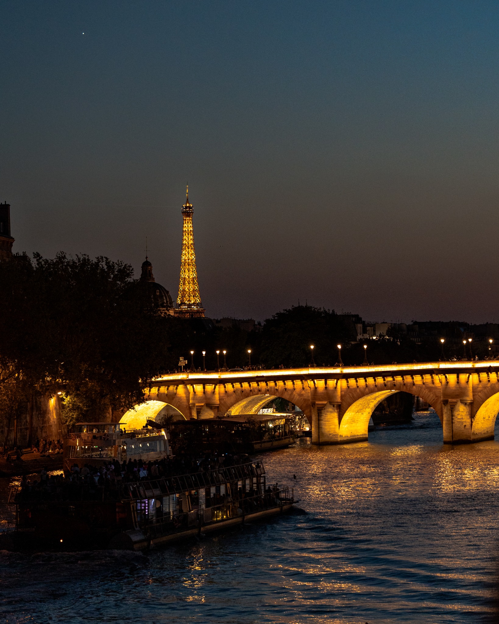 The Seine, Pont d'Iéna and the Eiffel Tower after sunset